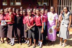 Students participate in the Take Charge Program along with their teacher, Annie Jere (in purple dress, second right) and Bible Society of Malawi Bible Youth Advocates Project Officer, Miss Silvia Matola (far right).  Photo by Rhoda Gathoga.